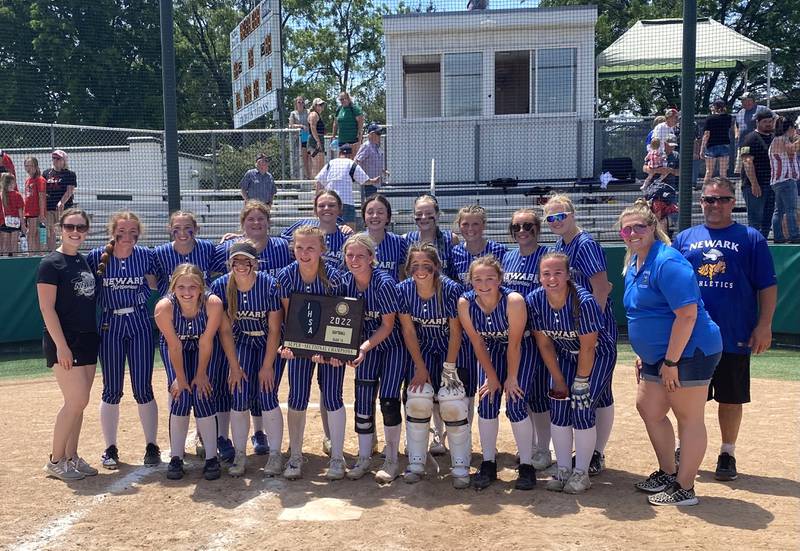 The Newark Norsemen pose at home plate of Bloomington's Inspiration Field with their freshly won Class 1A Illinois Wesleyan Super-Sectional championship plaque Monday, May 30, 2022.