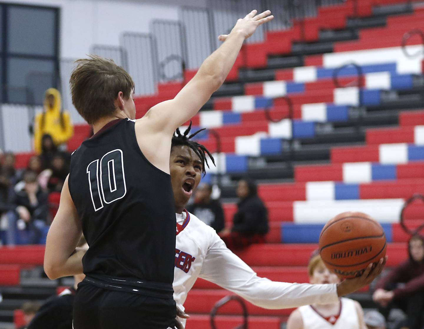 Dundee-Crown's Kali Freeman tries to drive to the basket under Prairie Ridge's Cade Collins during a Fox Valley Conference basketball game Wednesday, Dec. 14, 2022, between Dundee-Crown and Prairie Ridge at Dundee-Crown High School in Carpentersville.