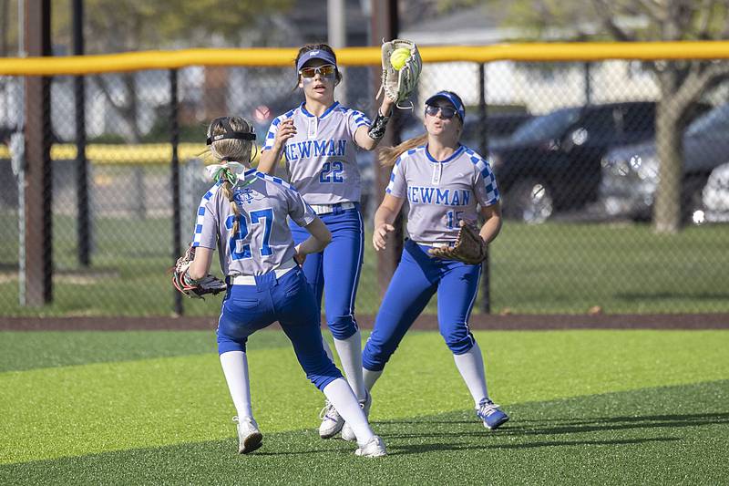 Newman’s Madison Duhon fields a ball that dropped between a trio of players against Sterling Thursday, April 27, 2023.