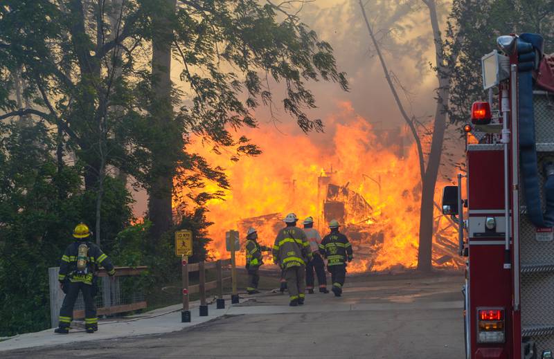 Cabins at Grand Bear Resort in Utica are engulfed in flames Monday, May 30, 2022.