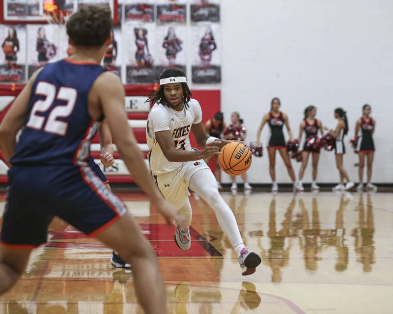 Yorkville's Braydon Porter (22) drives down the lane during their basketball game between Oswego at Yorkville Friday, Dec 12, 2025 in Yorkville.