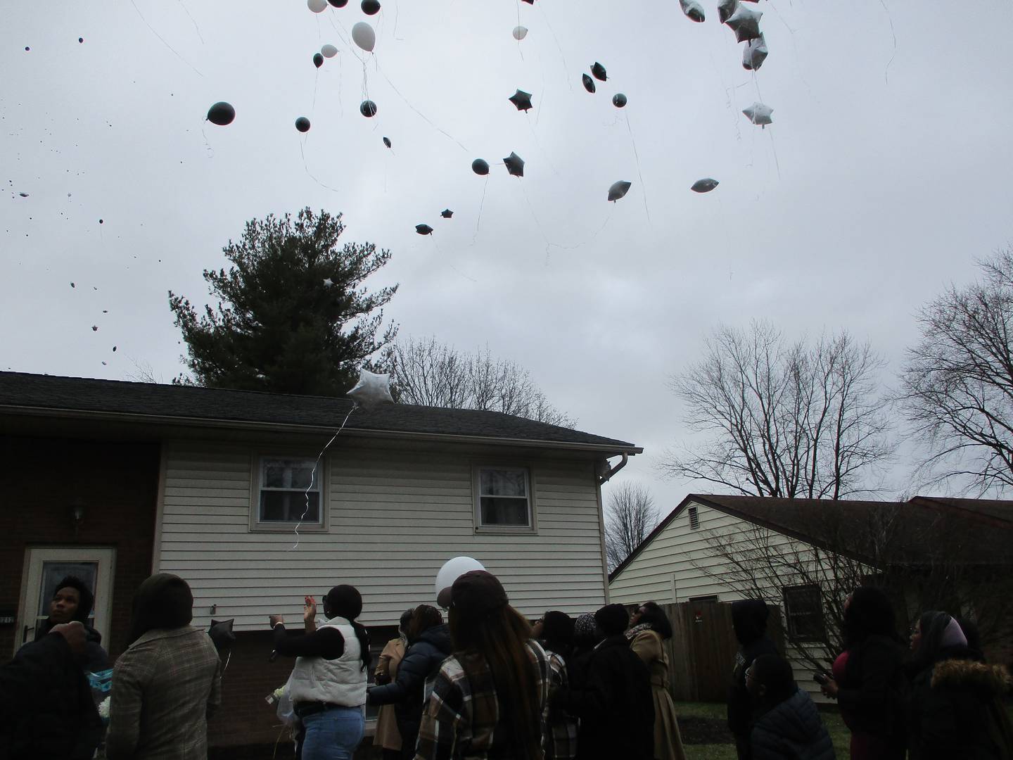 Balloons are released in a tribute to those who lost their lives during a vigil at the scene of the shootings on West Acres Road in Joliet on Sunday, Jan. 28, 2024.