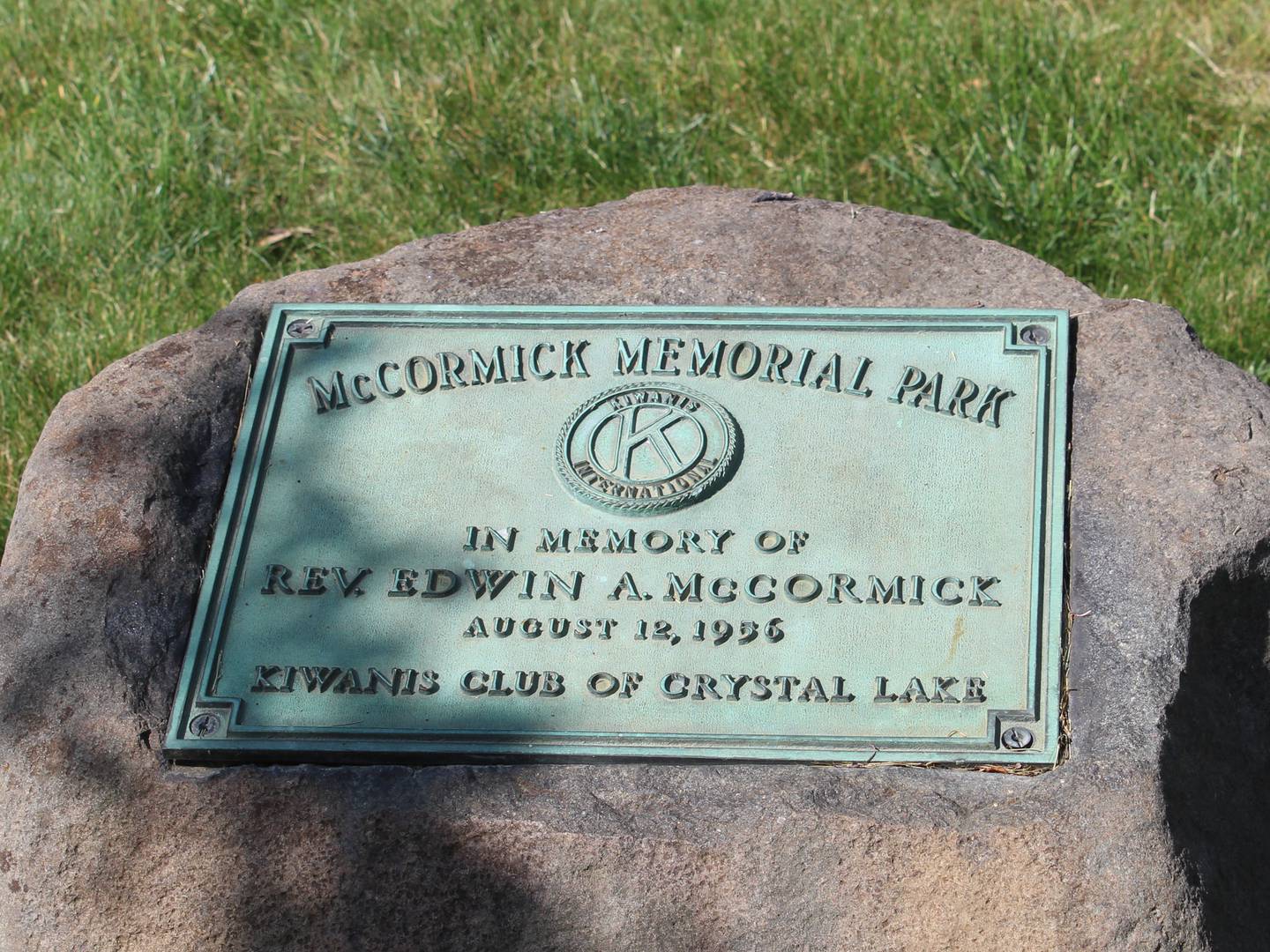 A plaque dedicating the Crystal Lake park to Father Edwin McCormick in 1956.