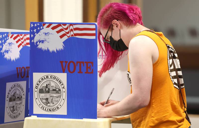 Nicc Misner, of DeKalb, votes Tuesday, June 28, 2022, at the polling place in Westminster Presbyterian Church in DeKalb.