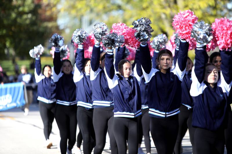 Members of the Downers Grove South dance team members walk in the school’s annual homecoming parade on Friday, Oct. 20, 2023.