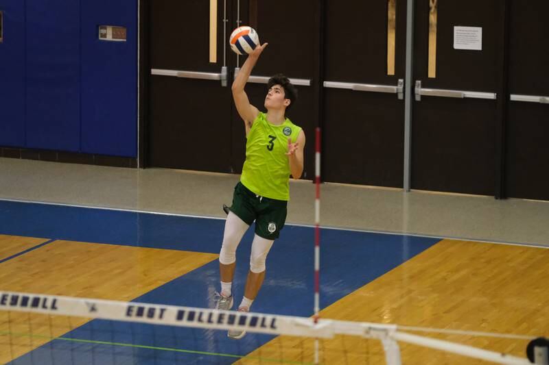 Glenbard West’s Kenny Gbson serves the ball against Roncalli (IN) in the Lincoln-Way East Tournament title match. Saturday, April 30, 2022, in Frankfort.