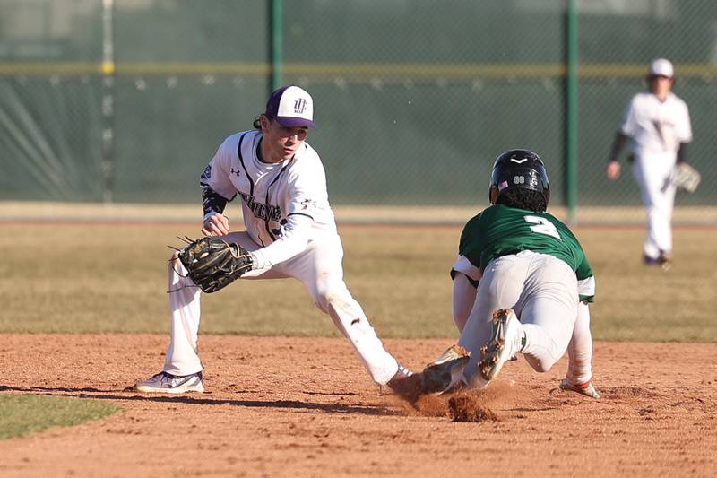 Joliet Junior College’s Gavin Callaghan tags out a steal attempt by Moraine Valley’s Yashion Boswell on Tuesday, March 7th, 2023.