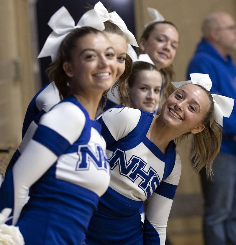 The Newman cheer squad smiles for the camera against Erie-Prophetstown Wednesday, Jan. 29, 2025, at Newman High School.