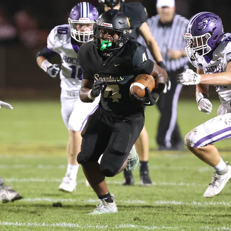 Sycamore's Tyler Curtis gets behind the Rochelle defense on his way to a touchdown during their game Friday, Sept. 22, 2023, at Sycamore High School.