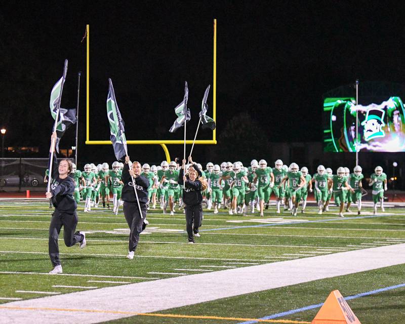 York football team takes the field for the start of the game on Friday Oct. 17, 2025, while taking on Glenbard West held at York High School