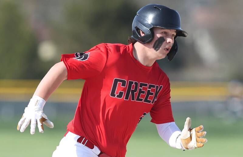 Indian Creek's Sam Genslinger rounds third on his way to scoring the first run of their game against IMSA Monday, May 9, 2022, in Shabbona.