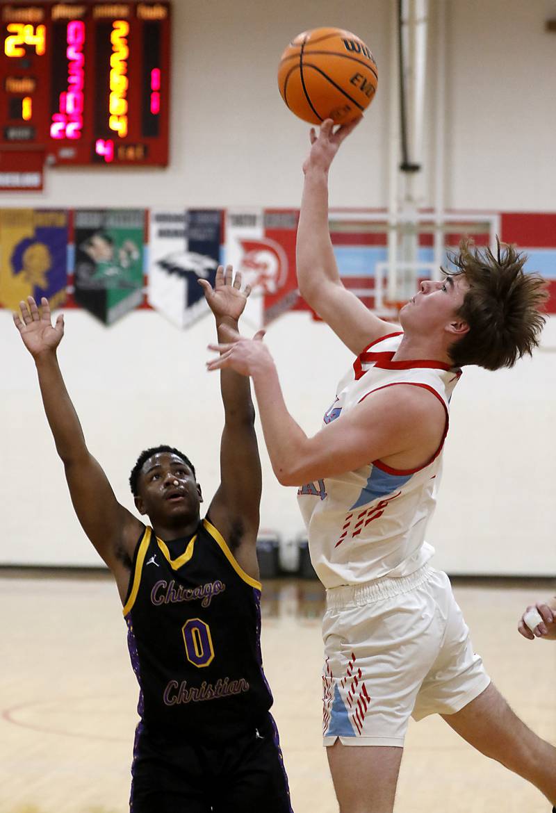 Marian Central's Finn Pivnicka shoots the ball after being fouled by Chicago Christian's Kerry Teague during a Chicagoland Christian Conference basketball game on Tuesday, Jan. 21, 2025, at Marian Central High School.