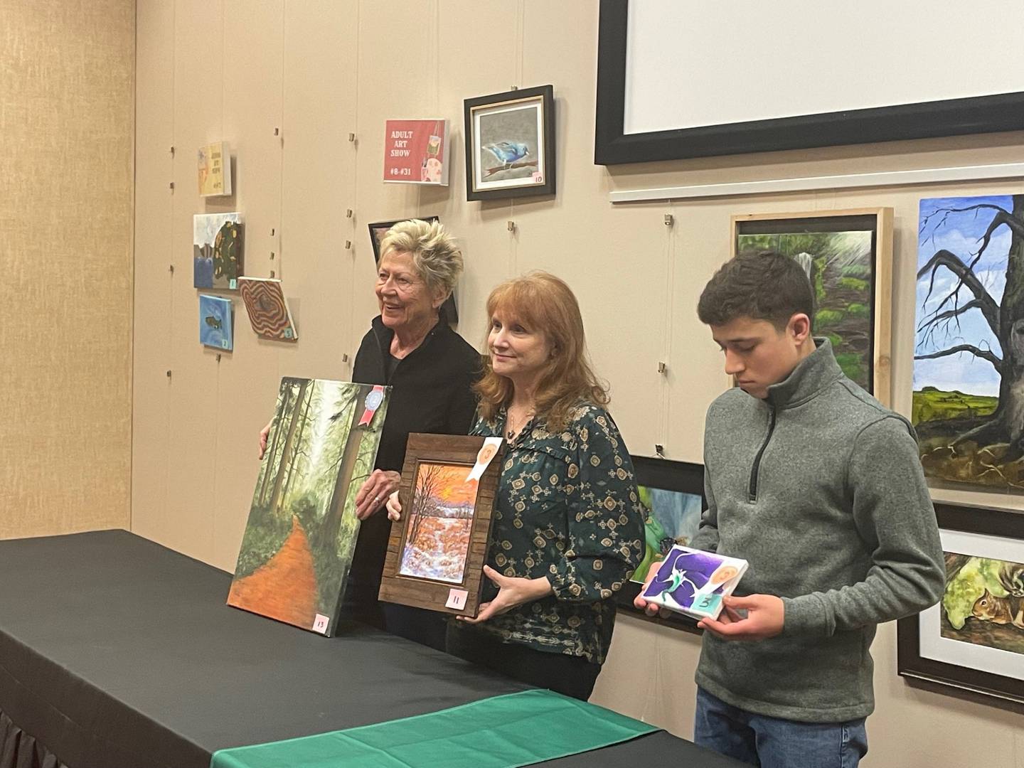 Runners-up in the Starved Rock Art Show are (from left) Pat Seibert, Beth Berry and Gavin Stevenson. (Not pictured is Helena Lopez, who won Best in Show and second place, both in the youth division.) All were honored at the awards presentation Saturday, March 1, 2025, at the Starved Rock Visitors Center.