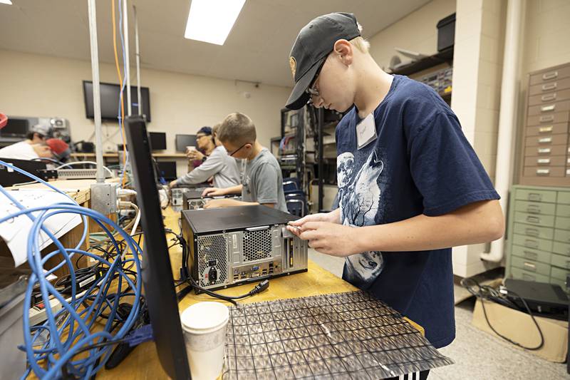 Tanner Johnson, 14, of Polo works on a computer Thursday, July 13, 2023 during the WACC computer science trades camp session.