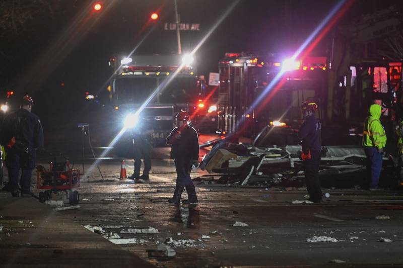 Investigators look over the Apollo Theatre after a severe spring storm caused damage and injuries during a concert, late Friday, March 31, 2023, in Belvidere, Ill. (AP Photo/Matt Marton)