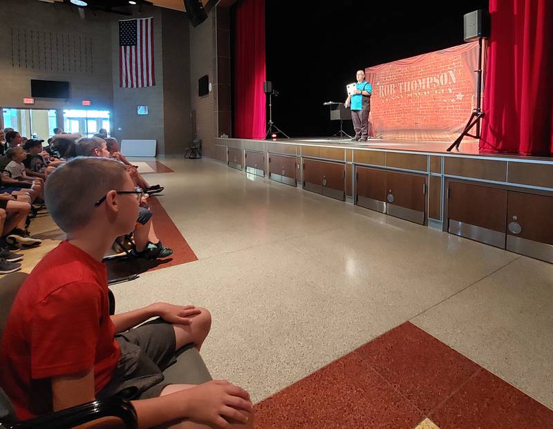 Children watched magician Rob Thompson on Wednesday, June 21, 2023, during a show presented by the Ottawa Recreation at Central Intermediate School.