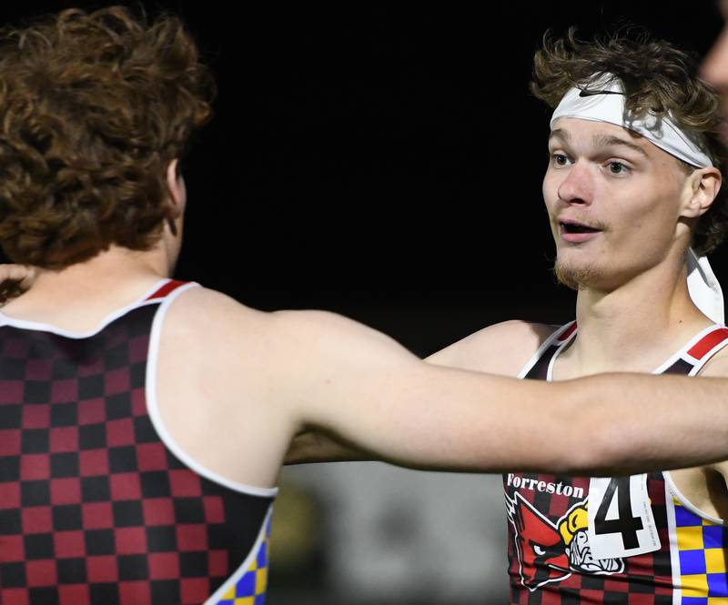 Forreston-Polo's Brody Schwartz (right) and Eli Ferris (left) embrace after winning 4x400 relay at the 1A Oregon Sectional on Friday, May 22, 2026.