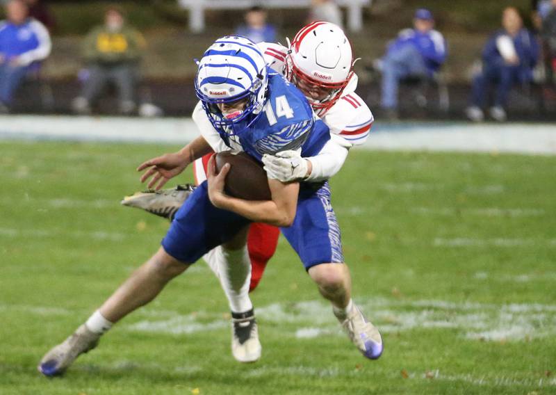 Princeton quarterback William Lott is brought down behind the line of scrimmage by Oregon's Avery Lewis during the Class 3A playoff game on Friday, Nov. 1, 2024 at Princeton High School.