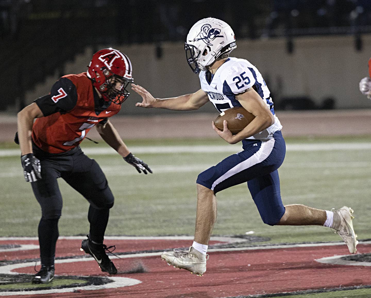 Ridgewood’s Roy Sandburg fights for yards against Amboy’s Troy Anderson during the I8FA championship Friday, Nov.17, 2023 at Monmouth College