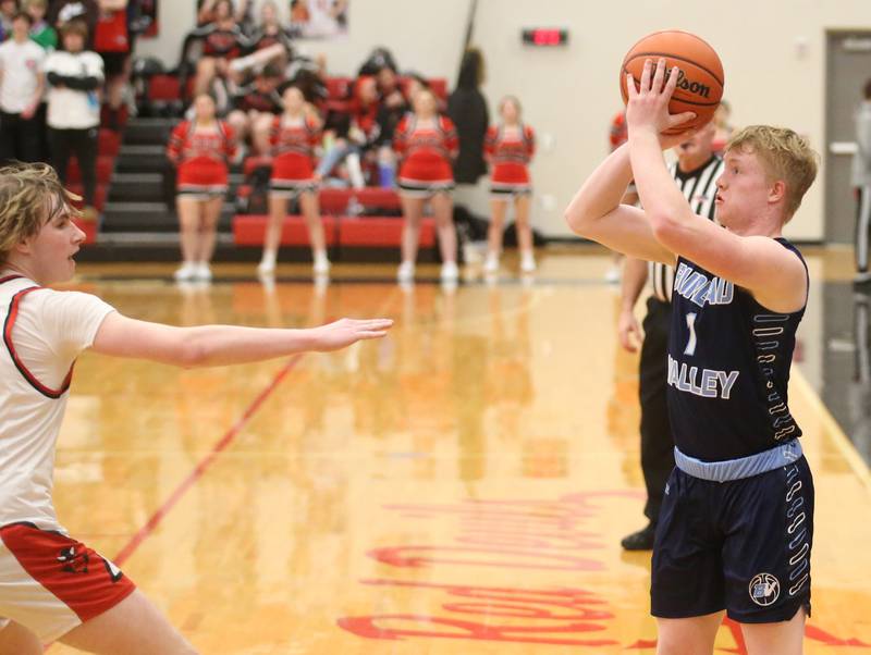 Bureau valley's Bryce Helms shoots a shot over Hall's Wyatt West on Tuesday, Feb. 6, 2024 at Hall High School.