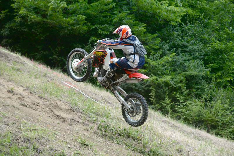 Wade Schultz of Lisbon, Iowa and his motorcycle fly in the air as he makes a run at the Rock River Riders Motorcycle Club's Father's Day Hillclimb on Sunday, June 15, 2025.