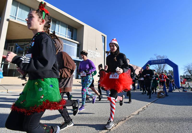 Dressed as an elf, Kelly O’Connor, 14, of Kankakee, begins running in the 32nd annual Jingle Bell Run at Kankakee Community College. The event returns to the college on Sunday.