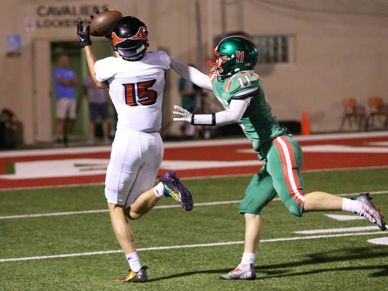 Metamora's Kendrick Schaffrin catches a pass over L-P's Kaleb Kennedy on Friday, Sept. 1, 2023 at Howard Fellows Stadium.
