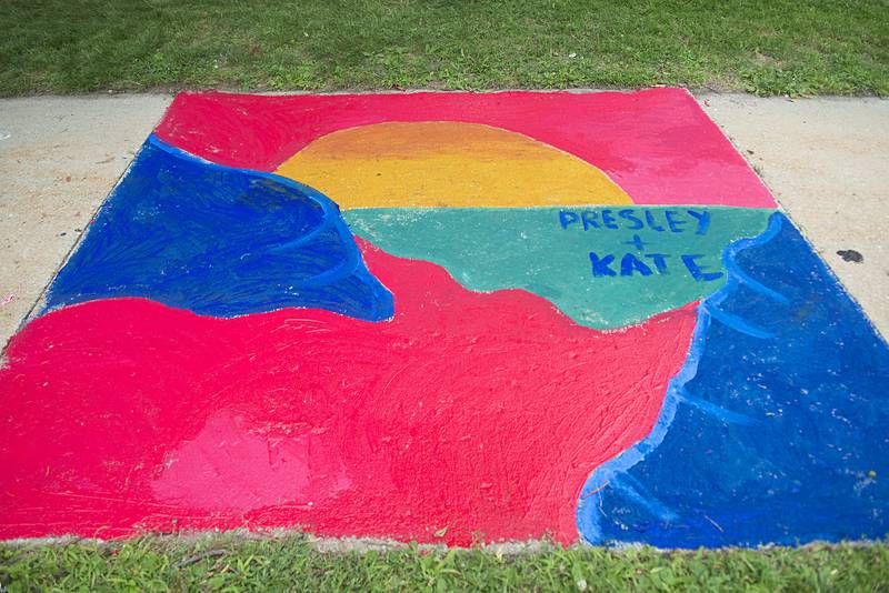 Many colorful works of art can be admired on the sidewalk of the old Lee County Courthouse as part of Petunia Fest’s Brush and Bloom event.