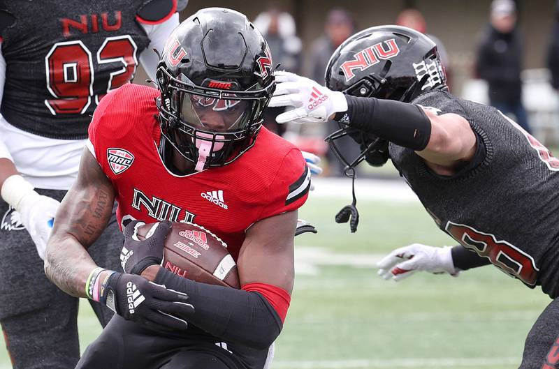 Northern Illinois Billy Dozier sneaks by linebacker Nick Alvarado for a touchdown during the Spring Showcase Saturday, April 22, 2023, at Huskie Stadium at NIU in DeKalb.