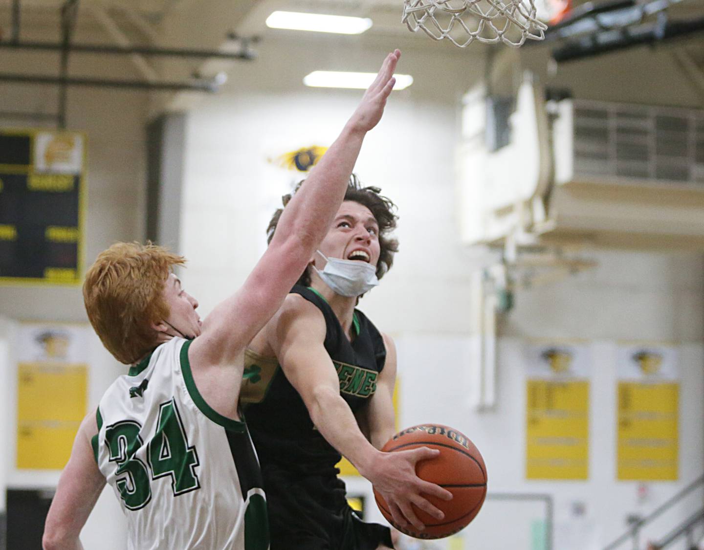 Seneca’s Zach Pfiefer (3) runs in the lane to score a basket over Midland’s Ryan Riddell (34) at the Tri-County Conference Tournament on Friday Jan. 28, 2022 in Granville.