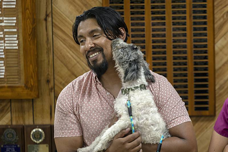 Army veteran David Martinez is greeted by his new therapy dog “Ice” Friday, August 11, 2023 in Sterling.