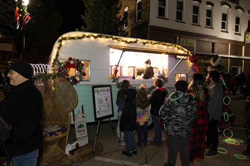 Pint Sized Mobile serves drinks to the parade crowd, courtesy of the City of Spring Valley, on Saturday, Nov. 26, 2022.