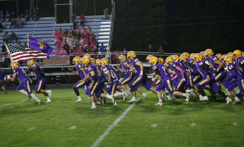 Members of the Mendota football team take the field to play Princeton on Friday, Oct. 10, 2025 at Bryant Field in Princeton.