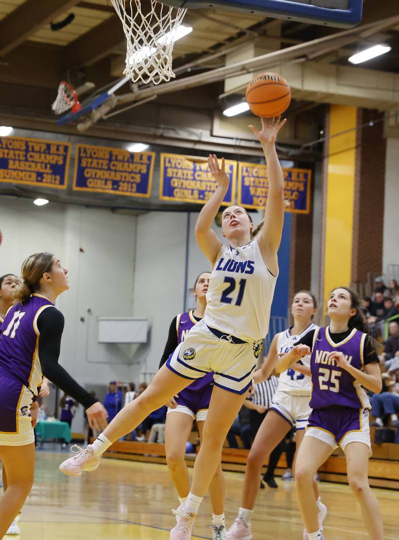 Lyons' Gwen Smith (21) puts up a shot during the girls varsity basketball game between Downers Grove North and Lyons Township on Saturday, Jan. 11, 2025 in La Grange.