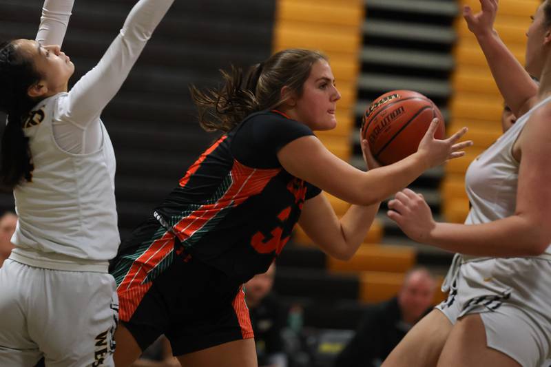 Plainfield East’s Addison Haughian passes out of the paint against Joliet West on Thursday, February 2nd.