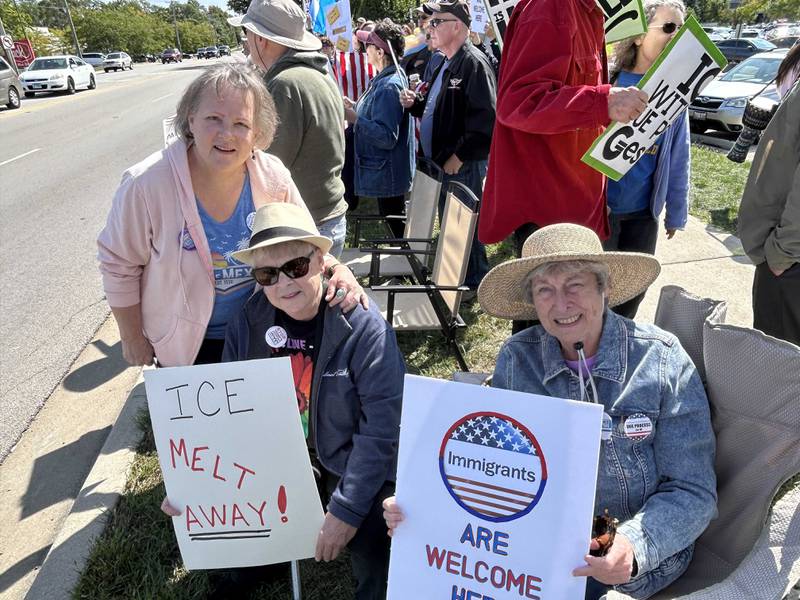 Emily Ellsworth, left, Penny Ellsworth and Jana Cronin protested federal immigration enforcement at a rally Saturday in Wheaton. “Once (Donald) Trump got reelected, that did it,” Penny Ellsworth said. “We just cannot sit still.”