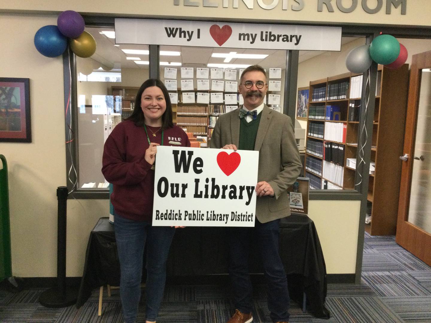 Ottawa Mayor Robb Hasty (right) visits the Reddick Library on Monday, April 7, 2025, for National Library Week.