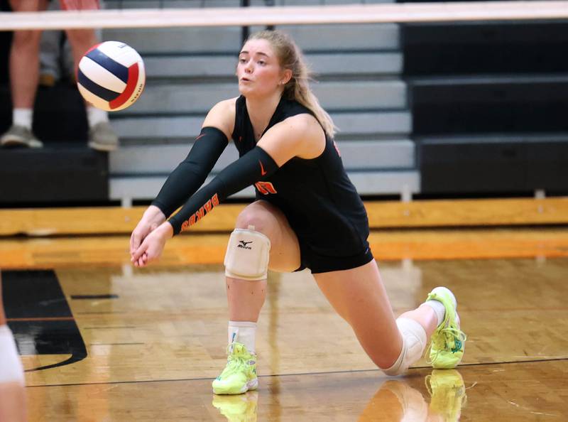 DeKalb's Isabelle Smith receives a Genoa-Kingston serve during their match Wednesday, Sept. 10, 2025, at DeKalb High School.