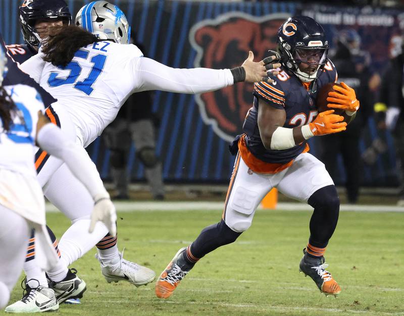 Chicago Bears running back Kyle Monangai gets outside of Detroit Lions defensive tackle Roy Lopez for good yardage during their game Sunday, Jan. 4, 2026, at Soldier Field in Chicago.