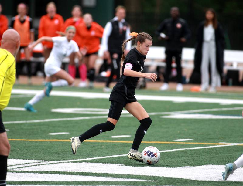 Wheaton Warrenville South's Ashlyn Adams dribbles the ball during a Class 3A Glenbard West Sectional semifinal game against Glenbard West on Tuesday, May 27, 2025 in Glen Ellyn.