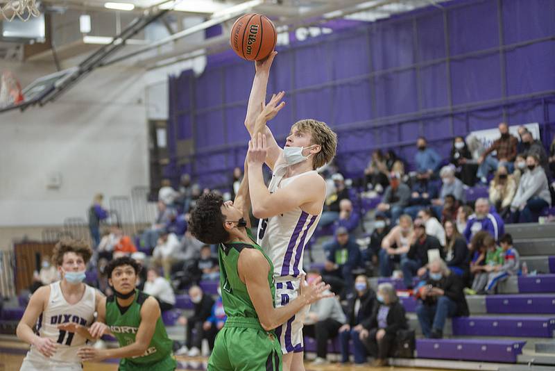 Dixon's Karson Glessner puts a shot up against North Boone Thursday, Jan. 13, 2022.
