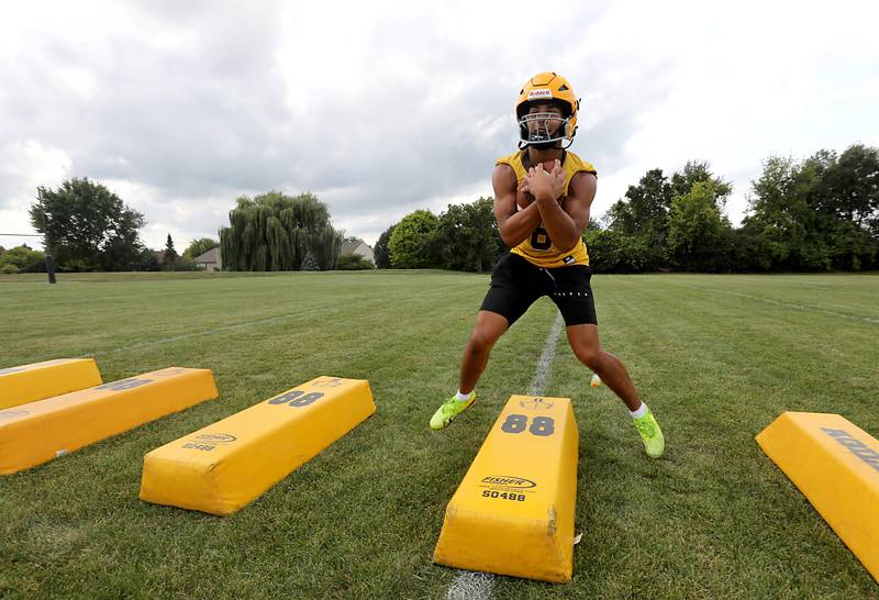 Jacobs’ Justin Gonzalez runs a footwork drill during football practice on Tuesday, August 15, 2025, at Jacobs High School in Algonquin.