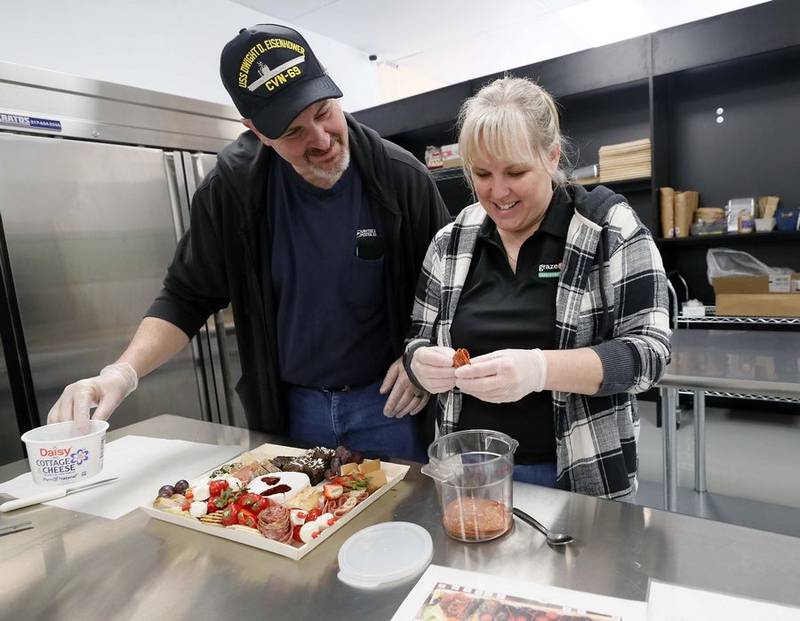 Kelly Clark and her husband, Chris, recently opened their Graze Craze catering business, which creates charcuterie boards and boxes of carefully selected ingredients, at 1437 W. Schaumburg Road in Schaumburg.