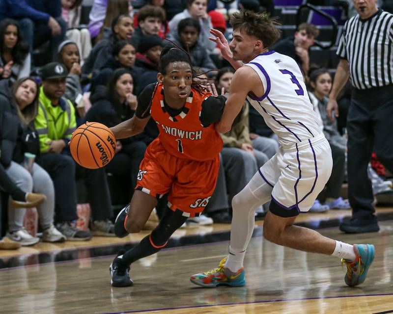 Sandwich's Simeion Harris (1) drives to the basket during their basketball game between Sandwich at Plano. Jan 27, 2025 in Plano.