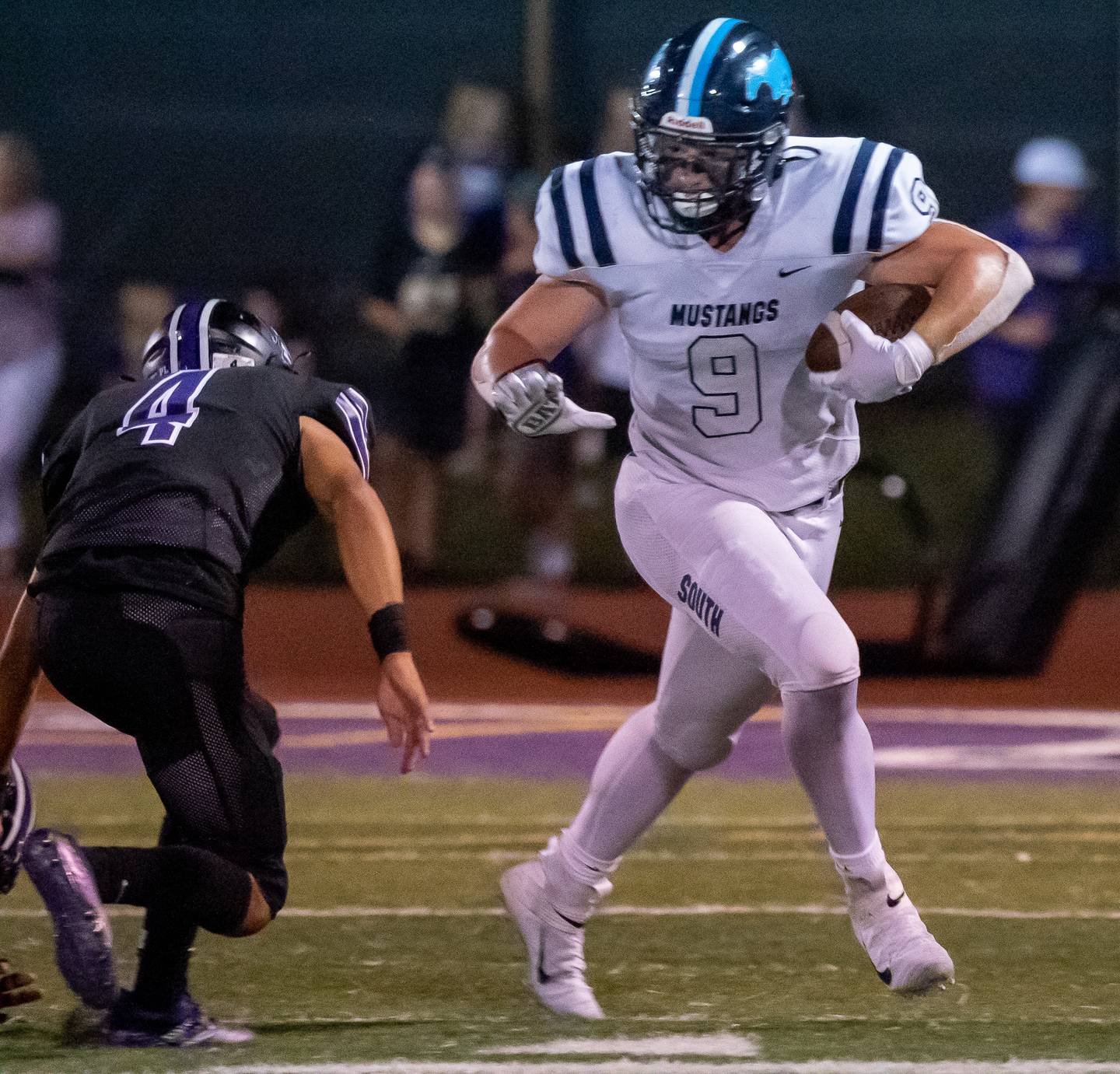 Downers Grove South's Mack O'Halloran (9) carries the ball against Downers Grove North during a football game at Downers Grove North High School on Friday, Sep 9, 2022.