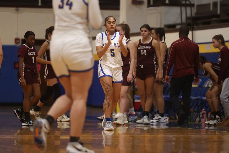Joliet Central’s Joyce Tua-Link celebrates win against Lockport.