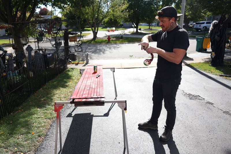 Dave Appel works on his Halloween display, featuring a levitating Max from the Netflix show "Stranger Things." Video of it has gone viral on social media. Tuesday, Sept. 27, 2022, in Plainfield.