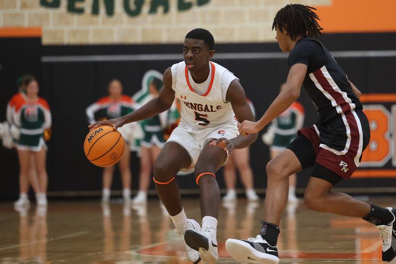 Plainfield East’s Christopher Tchoffa works the ball against Plainfield North on Tuesday, Jan 14, 2025.