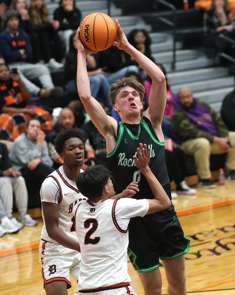Rock Falls' Max Burns goes to the basket against DeKalb's Aaron Ziga during their game Tuesday, Dec. 2, 2025, at DeKalb High School.