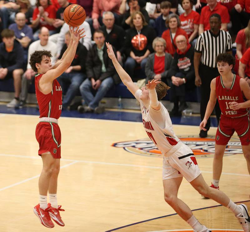 L-P's Jack Jareb shoots a jump shot over Metamora's Tyler Mason during the Class 3A Sectional on Tuesday, Feb. 27, 2024 at Pontiac High School.